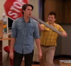 Gibby hitting Spencer with a stop sign meme